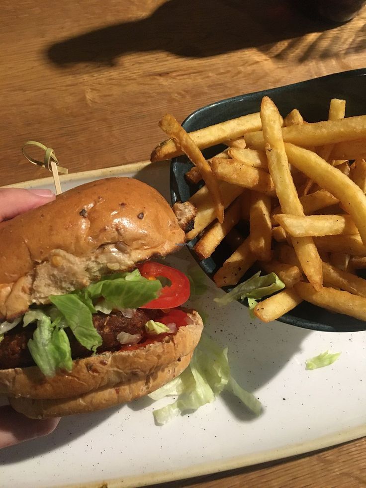 a hamburger and french fries on a plate