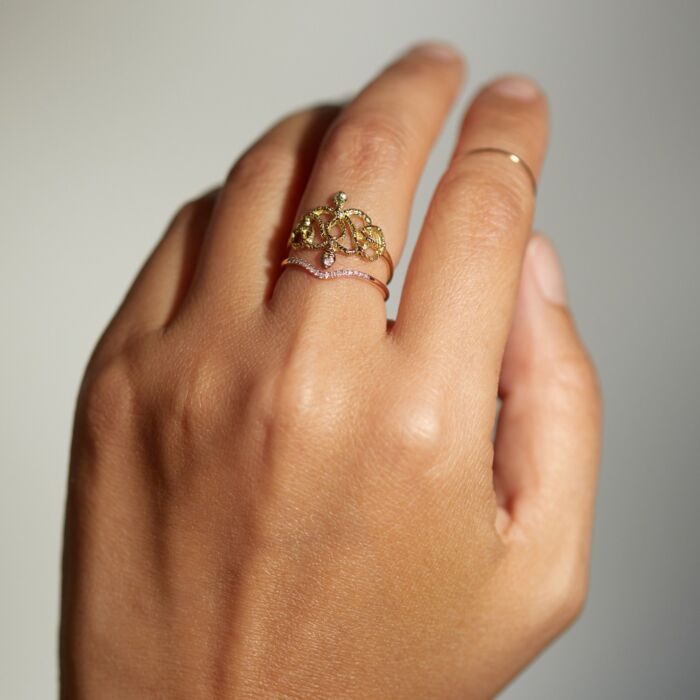 Two snakes with diamond eyes woven together, forever and ever. A symbol of never-ending love, delicately crafted from gold that feels touched by time. Diamond Snake Ring With Single Cut Diamonds As Gift, Gold Snake Ring With Diamond Accents As Gift, Gold Snake Ring With Diamond Accents For Gift, Yellow Gold Snake Ring With Diamond Accents For Gift, Gold Snake Ring With Single Cut Diamonds, Yellow Gold Snake Ring With Diamond Accents For Wedding, Yellow Gold Diamond Snake Ring, Wedding Snake Ring In Yellow Gold With Diamond Accents, Wedding Yellow Gold Snake Ring With Diamond Accents