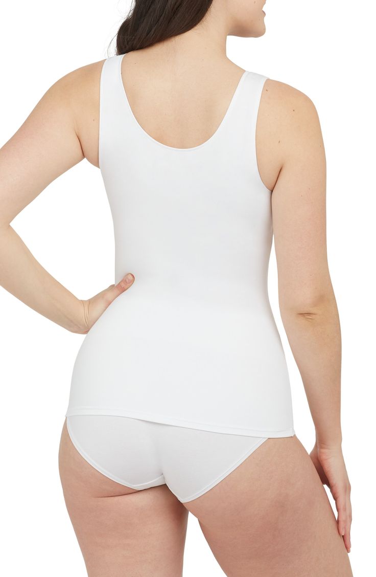 Feel supported in this lightly compressive tank top made of brushed, single-layer microfiber jersey that's perfect for layering. Scoop neck 77% polyester, 23% elastane Machine wash, tumble dry Imported Versatile Micro-elastic Seamless Top, Seamless Micro-elastic Versatile Top, Compressive Seamless Top For Layering, Seamless Compressive Tops For Layering, White Elastane Tank Top With Built-in Bra, Workout Tops With Built-in Bra Second-skin Fit, Second-skin Workout Top With Built-in Bra, White Tank Top With Built-in Bra, Versatile Seamless Second-skin Tops