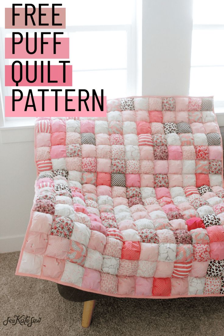 a pink and white quilt sitting on top of a wooden chair