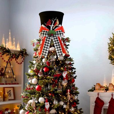 a christmas tree decorated with red, white and black ornaments