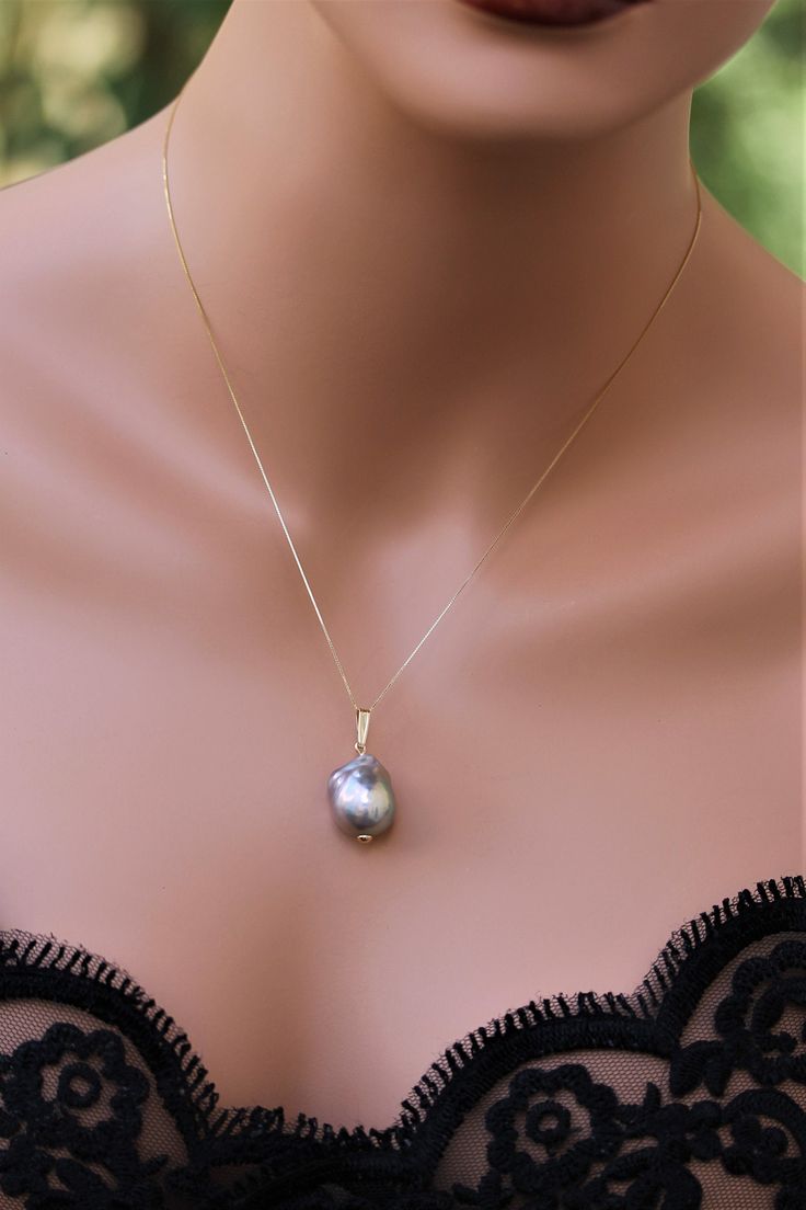 Gorgeous Large super iridescent Baroque Pearl on 14KY Gold Pearl are the symbol of New beginnings, June birthstone and 30th anniversary. Pearls are the most elegant and versatile accessory, they do not have to be reserved for special occasions anymore and can be a perfect jewelry for any attire. Specs: Pearl Type: Baroque Flameball Origin: South Sea, Tahiti and some parts of Asia Pearl color: Super iridescent Gray with strong blue, pink and green undertone Shape: Teardrop Pearl size: 16x12x12 Ch Heirloom Gold Jewelry With High Luster, Heirloom High Luster Gold Jewelry, Heirloom High-luster Gold Jewelry, Pear-shaped Diamond Cut Jewelry For Wedding, Fine Jewelry Drop Earrings With High Luster, Heirloom Pearl Pendant For Wedding, Teardrop Yellow Gold Jewelry For Celebration, White Gold Wedding Necklace Stamped 14k, Celebration Yellow Gold Jewelry With Pearl Pendant