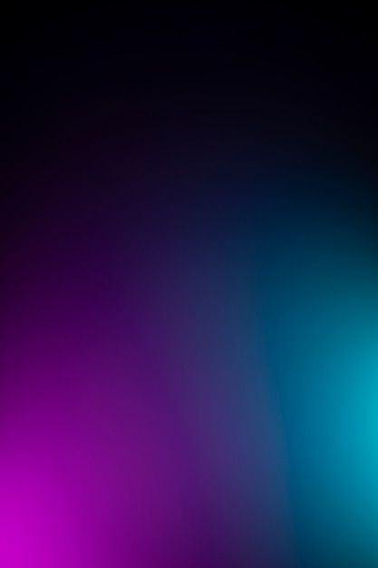 a blurry image of blue and purple colors on a black background with the light reflecting off it's side