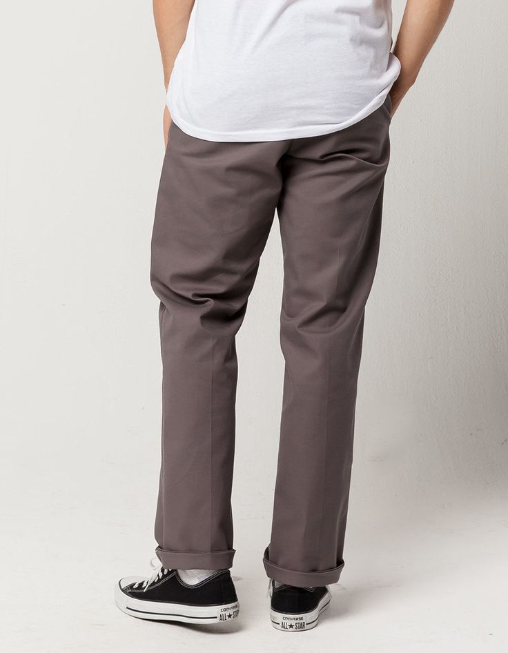 Dickies 850 slim taper flex pants. Slant front pockets with button welt back pockets. Zip fly with contrast trim at zipper. Button waist. Approx leg opening: 14"(36cm). 65% polyester/35% cotton. Machine wash. Imported. Classic Straight Leg Dress Pants With Buttons, Fall Flat Front Bottoms With Button Closure, Fall Straight Leg Bottoms With Snap Buttons, Casual Pants With Snap Buttons For Fall, Casual Fall Pants With Snap Buttons, Classic Tapered Leg Bottoms With Buttons, Business Casual Bottoms With Buttons And Tapered Leg, Casual Pants With Button Zip Fly, Business Casual Tapered Leg Bottoms With Buttons