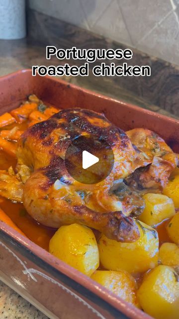 a roasting pan filled with potatoes and chicken