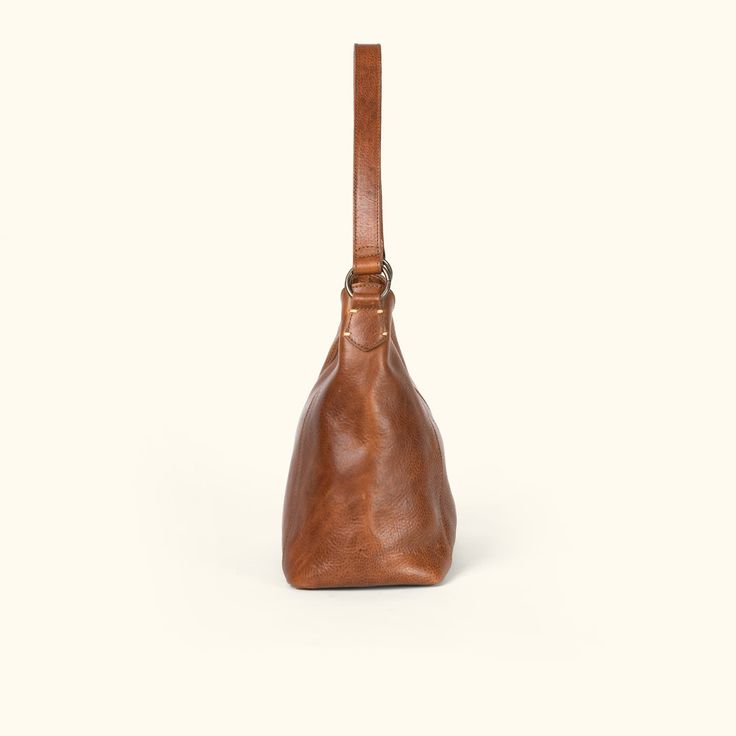 Walker Leather Shoulder Bag | Rustic Tan hover Cognac Bags With Brass Hardware And Top Handle, Cognac Top Handle Bags With Brass Hardware, Cognac Bag With Brass Hardware And Top Handle, Everyday Timeless Leather Shoulder Bag, Timeless Leather Shoulder Bag For Everyday, Timeless Soft Leather Hobo Shoulder Bag, Timeless Cognac Shoulder Bag With Adjustable Strap, Timeless Crossbody Shoulder Bag With Brass Hardware, Business Shoulder Bag In Vegetable Tanned Leather