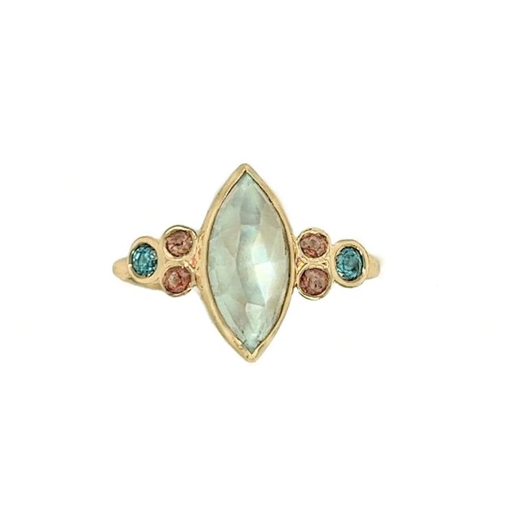 This incredible Marquis Moonstone is set between clusters of vibrant Blue Zircons and Warm Peach Sapphires. Finished with Emily's handmade Seagrass band we love it as an alternative engagement ring or right hand ring. Approximate stone size: 12mm x 6mm 2.3cts Mohs Stone Hardness: 6-6.5 This one of a kind piece is handmade to order in Emily's Hudson Valley studio. If you have questions about sizing, shipping or custom orders please reach out to us! Celestial Wedding Ring With Bezel Setting, Marquise Multi-stone Cluster Ring Fine Jewelry, Fine Jewelry Marquise Multi-stone Cluster Ring, Fine Jewelry Marquise Multi-stone Ring, Celestial Multi-stone Diamond Jewelry, Heirloom Rings With Rose Cut Diamonds And Blue Topaz, Celestial 14k Gold Rings With Center Stone, Fine Jewelry Topaz Multi-stone Rings, Heirloom Style Blue Topaz Rings With Rose Cut Diamonds