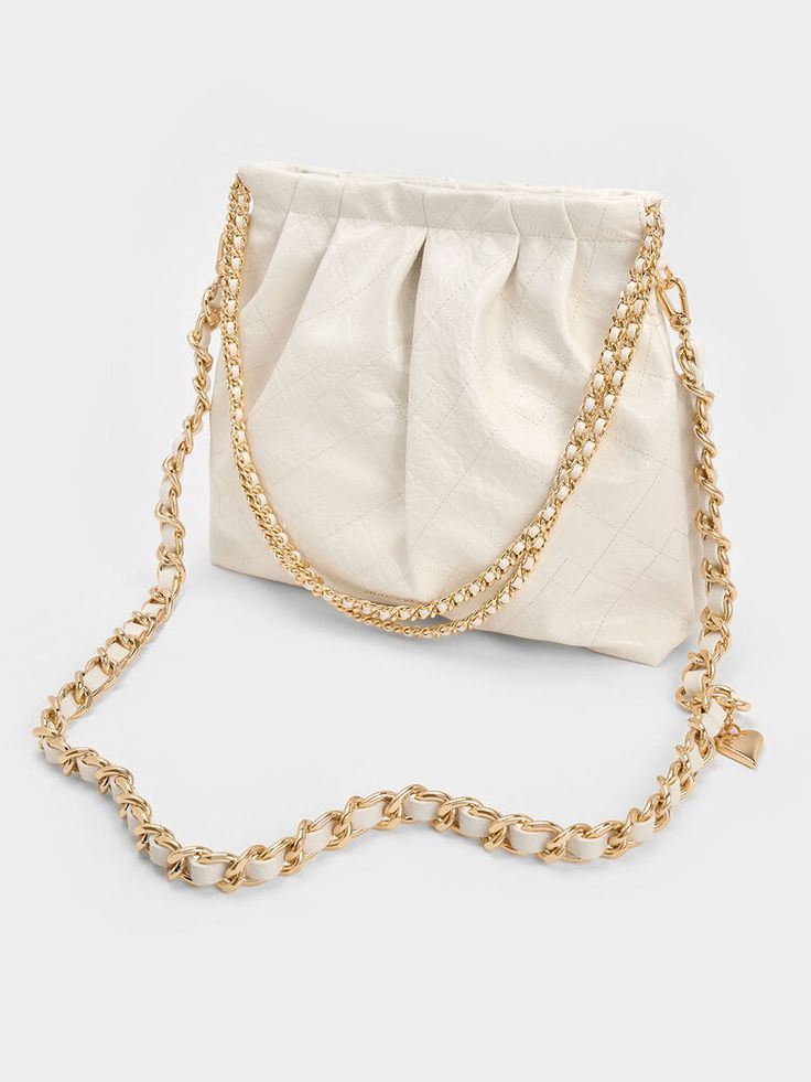 Cream Duo Double Chain Hobo Bag | CHARLES & KEITH Everyday Cream Bag With Chain Strap, Chic Rectangular Hobo Bag With Chain Strap, Chic Hobo Shoulder Bag With Chain Strap, Chic Bags With Chain Strap For Errands, Elegant Bags With Chain Strap For Errands, Chic Shoulder Bag With Chain Strap For Errands, Chic Cream Bag With Chain Strap, Elegant Cream Bag With Chain Strap, Cream Evening Bucket Bag In Pouch Shape