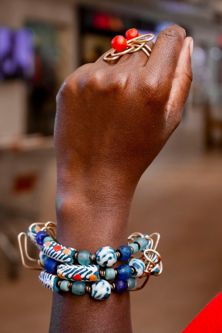 How fun is it to have hand-painted authentic beads!This chic Blue bracelet is a blend of beautiful Segi and Gas beads from West Africa. It beautifully fills out your wrist being almost 2 inches wide and 7.5 inches long. We add extra links to allow you to adjust it. Step out in style with our handmade layered Blue beaded Bracelet! Thank you for visiting our store! Xoxoxo Atiamuga Artisan Blue Bracelets For The Beach, Adjustable Blue Beaded Bracelets With Wooden Beads, Blue Wooden Beaded Bracelets For Beach, Blue Wooden Beads Bracelet, Blue Bohemian Beaded Bracelets With Large Beads, Bohemian Blue Bracelets With Spacer Beads, Blue Bohemian Bracelets With Spacer Beads, Artisan Blue Beaded Bracelets For Beach, Blue Wooden Bead Bracelet