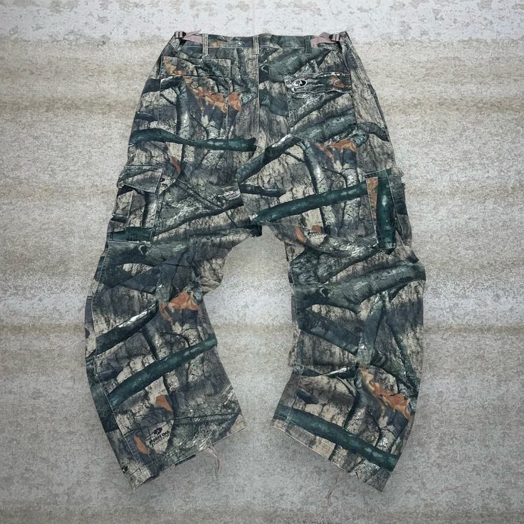 a pair of camouflage pants laying on the ground