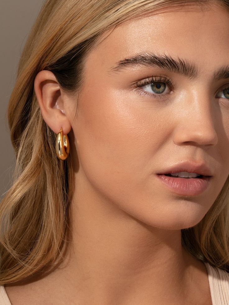 Standout in a sea of gold hoops with our Rare Hoop Earrings. These unique hoops will bring some shape and dimension to your ear stack. Wear them front and center of your stack and style with a simple earring, or be bold and layer with our marbled pink Tube Hoop Earrings. Everyday Small Hoop Earrings Tarnish Resistant, Trendy Tarnish Resistant 14k Gold Filled Hoop Earrings, Trendy Gold Plated Huggie Hoop Earrings, Chic Hoop Earrings With Ear Wire, Trendy 14k Gold-filled Yellow Gold Hoop Earrings, 14k Gold Filled Hoop Cartilage Earring, Single 14k Gold-filled Hoop Cartilage Earring, Modern Small Hoop Pierced Earrings, Modern Tarnish Resistant Hoop Earrings