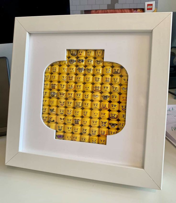 a white frame with some yellow legos in it