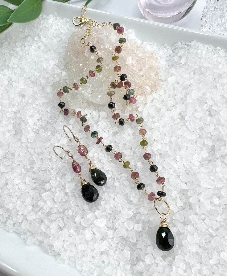 Beautiful necklace & earring set with faceted Watermelon Tourmaline gemstones. All gold filled components. The necklace consists of faceted Watermelon Tourmaline that is hand wrapped into a rosary style chain and includes the Green Tourmaline removable pendant. It is finished off with a lobster clasp & dangle of gold filled beads. Necklace measures 16-18" and can be adjusted anywhere in between. Pendant measures 7/8" long X 3/8" wide. The earrings have smooth Watermelon Tourmaline stones accente Watermelon Tourmaline Necklace, Tourmaline Necklace, Tourmaline Beads, Tourmaline Stone, Watermelon Tourmaline, Hand Wrap, Tourmaline Gemstone, Beautiful Necklace, Green Tourmaline