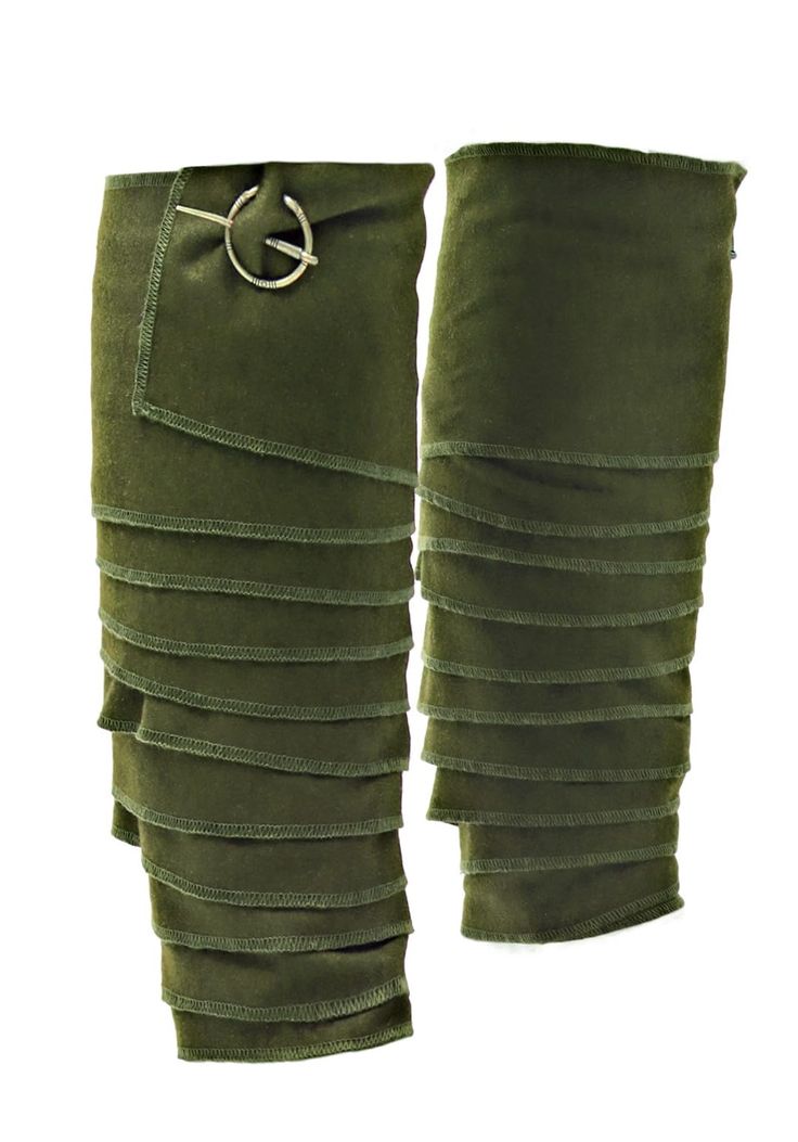 a pair of green knee high boots with ruffles