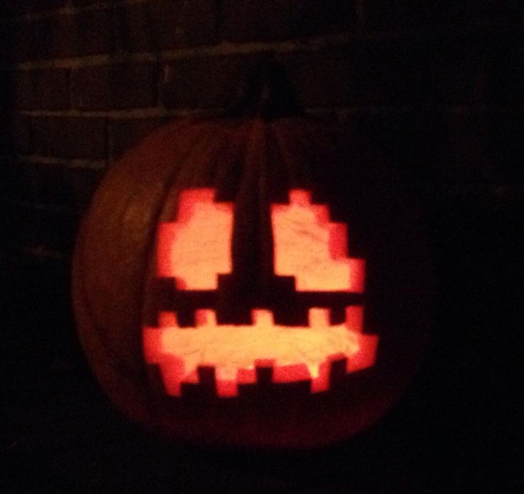 a pumpkin with an evil face carved into it