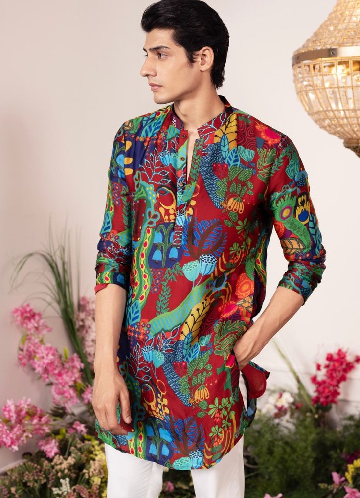 Introducing the Enchanted Forest Printed Kurta , an ideal ensemble for Mehendi and Sangeet. This printed kurta features a various vibrant botanical motifs on a crimson background, bringing an elegant vibe to your celebrations. Buy matching pants to complete the look here. Composition : Organza Satin Care: Dry Clean Only and Vacuum Storage This product can be customized for sleeves, length and colour Delivery : 2-4 weeks as the product is hand crafted. Check Size Guide or choose MySize for free customisation (All Sizes above XL can be made at 15% additional cost) For more information and sizes please contact fabiliciousfashion@gmail.com or visit our Copenhagen studio. About the Designer : Get ready to be blown away by the incredible talent of Juhi Bengani! This Kolkata-born actuary has disc