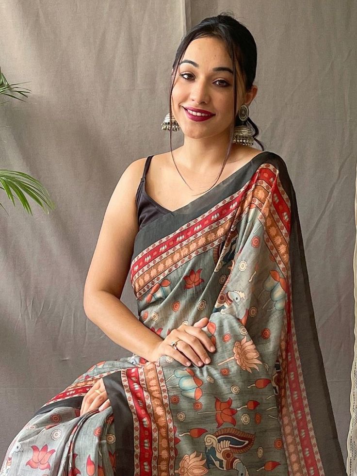 Introducing our beautiful grey saree and blouse, made from high-quality malai cotton, design inspired with traditional kalamkari prints. This exquisite ensemble combines the charm of tradition with the comfort of modern fashion, making it a must-have for every fashion-conscious woman.
The elegant grey saree is adorned with a stunning multicolour pattern, adding a touch of vibrancy and elegance to your look. The design is meticulously crafted, allowing the kalamkari prints to shine through, creat Traditional Gray Saree For Diwali, Festive Cotton Pre-draped Saree With Printed Border, Festive Cotton Pre-draped Saree With Block Print, Multicolor Cotton Pre-draped Saree With Unstitched Blouse, Cotton Silk Pre-draped Saree With Kalamkari Print For Festivals, Festival Cotton Silk Pre-draped Saree With Kalamkari Print, Diwali Cotton Saree With Printed Motifs, Multicolor Cotton Pre-draped Saree For Festive Occasions, Bollywood Style Multicolor Cotton Pre-draped Saree