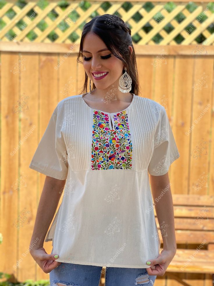 This Beautiful Hand embroidered blouse has a unique and Mexican inspired Floral design. The blouse has a beautiful traditional look to it and is made with fresh Mexican linen. The Jewelry modeled may be purchased here: Filigree Earrings: https://www.etsy.com/es/listing/872372628/filigrana-clasica-de-gota-arete-mexicano?ref=listings_manager_grid Multicolor Floral Embroidered Top For Navratri, Navratri Floral Embroidered Multicolor Top, Navratri Multicolor Floral Embroidered Top, Traditional White Embroidered Top, Bohemian Tops With Intricate Embroidery For Navratri, Traditional Tops With Intricate Embroidery For Navratri, Folk Peasant Top With Multicolor Embroidered Neckline, Traditional Embroidered Top With Embroidered Border For Festive Occasions, Bohemian Embroidered Top For Festivals