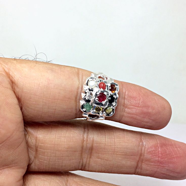 Genuine 925 Sterling Silver Navratan Ring Gemstone - Ruby , Emerald , Blue Sapphire, Yellow Sapphire, Hessonite, Cats Eye, Coral, Pearl, Cubic Zircona. Ring Size - QTY - 1 piece in this listing. The navratna or nine gems influencing the nine planets are: Ruby = Sun , Pearl = Moon, Red Coral = Mars, Emerald = Mercury, Yellow Sapphire = Jupiter, zircon = Venus, Blue Sapphire = Saturn, Hessonite = Rahu , Cat''s Eye = Ketu . Multicolor Sterling Silver Fine Jewelry Gemstones, Spiritual Multicolor Multi-stone Rings, Multicolor Sterling Silver Gemstones For Anniversary, Sterling Silver Multi-stone Ruby Ring, Sterling Silver Multi-stone Round Ruby Ring, Silver Gemstone Toe Ring, Silver Multi-stone Spiritual Rings, Multicolor Multi-stone Gemstones In Sterling Silver, Silver Gemstones For Promise Ring