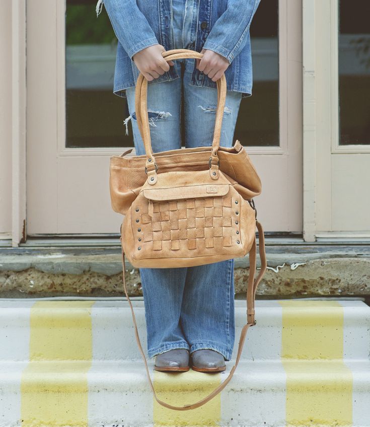 Grace your shoulder with this beautifully woven handbag, we call her MIRIAM.  We love this bag, as her interior is so spacious, but the best thing?  The base of MIRIAM is wide, so she sits upright.  Flat bottoms rule.  Padded shoulder straps are another thing we are loving, but an adjustable and removable crossbody strap comes with it as well to switch up your look. Finally, a zip-top closure gives you security piece of mind. MIRIAM checks a lot of boxes, give her a closer look, ~wink~. Woven Leather Satchel For On-the-go, Casual Woven Leather Crossbody Satchel, Leather Satchel Shoulder Bag With Intrecciato Weave, Casual Leather Shoulder Bag With Intrecciato Weave, Casual Leather Intrecciato Shoulder Bag, Daily Use Woven Leather Bucket Shoulder Bag, On-the-go Woven Leather Hobo Tote Bag, Everyday Intrecciato Weave Crossbody Shoulder Bag, Leather Satchel With Intrecciato Weave Tote Shape