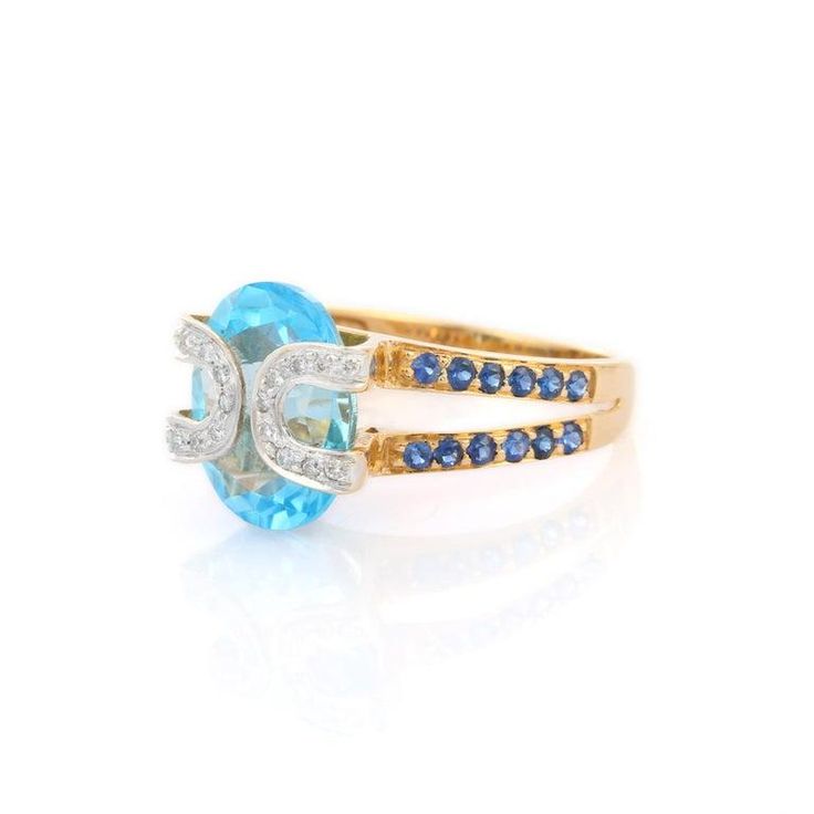 This is part of Chairish’s Fine Jewelry assortment.  Blue Topaz and Blue Sapphire Diamond ring in 18K Gold which perfectly goes with your personality and also helps you in learning and spiritual healing. This is a great bridesmaid, wedding or christmas gift for anyone on your list. Blue Topaz soothes, heals, stimulates, recharges, re-motivates your partner and aligns the meridians of the body – directing energy to where it is needed most.  Designed with Big Blue Topaz in center and halo of diamo Heirloom Blue Topaz Ring With Sapphire Color, Heirloom Style Blue Topaz Ring With Sapphire Color, Heirloom Blue Topaz Sapphire Ring, Luxury Topaz Wedding Ring With Birthstone, Heirloom Sapphire Blue Topaz Ring, Heirloom Blue Birthstone Ring For Promise, Heirloom Blue Birthstone Promise Ring, Blue Diamond Ring With Gemstone Accents, Luxury Blue Birthstone Ring For Wedding