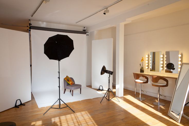 a photo studio with lighting equipment and mirrors