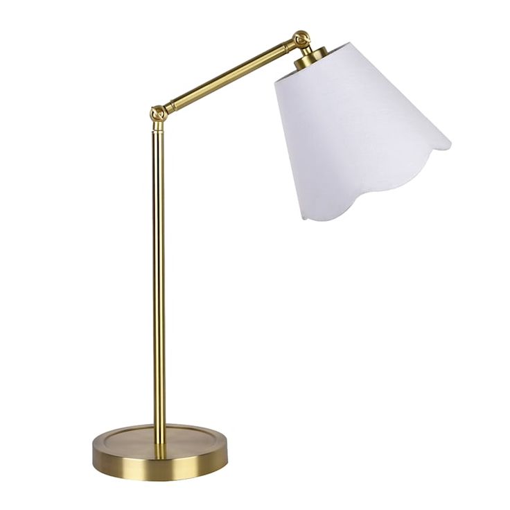 a gold desk lamp with a white shade on it's arm and a metal base