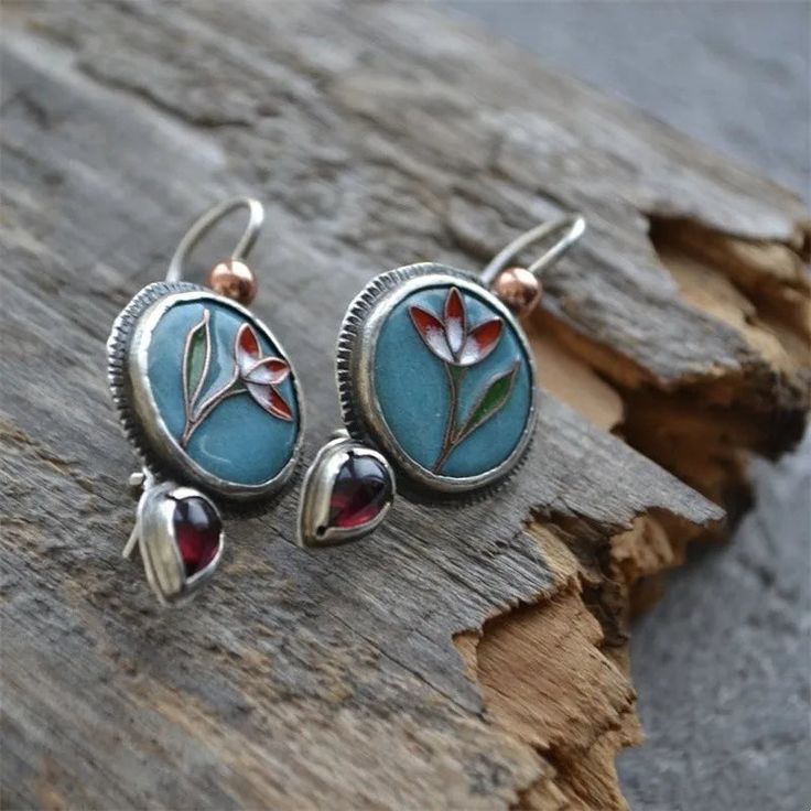 Add a unique pop of color to your outfit with these playful Water Droplet Inlaid with Purple Stone Earrings. The round silver design features a charming flower inlay and a dangling water droplet with a gorgeous Urôle stone. Made of high-quality zinc alloy for lasting wear. Blue Alloy Earrings For Gift, Handmade Alloy Earrings As Gift, Enamel Flower Earrings With Flower Charm, Enamel Flower Charm Earrings, Silver Teardrop Flower Earrings With Flower Charm, Metal Flower Earrings Gift Round Shape, Vintage Enamel Flower Earrings, Gift Metal Flower Earrings, Nickel Free Teardrop Metal Flower Earrings