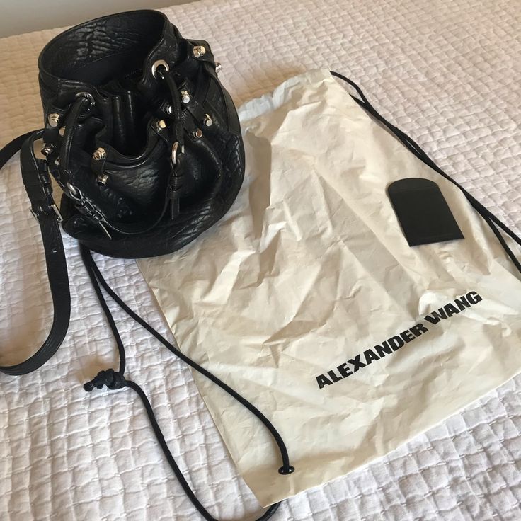 100% Authentic Alexander Wang Diego Bucket Bag In Great Condition! Used A Couple Of Times And Stored Nicely In Its Protective Bag. Leather Has No Tears And Hardware Still Shines. Minor Scratches To The Bottom Hardware But Hardly Noticed. Black Pebbled Leather, Silver Hardware. Crossbody Strap And Drop Handle For Multi Functional Wear Serious Buyers Leave Comments! Purchased From The Alexander Wang Store In Soho, Ny. Designer Bucket Bag With Removable Pouch, Designer Shoulder Bucket Bag, Designer Bucket Bag With Branded Hardware, Designer Travel Bucket Bag With Branded Hardware, Designer Black Bucket Bag With Double Handle, Designer Satchel Bucket Bag With Branded Hardware, Designer Crossbody Bucket Bag With Detachable Strap, Designer Leather Bucket Bag, Designer Black Bucket Bag With Top Handle