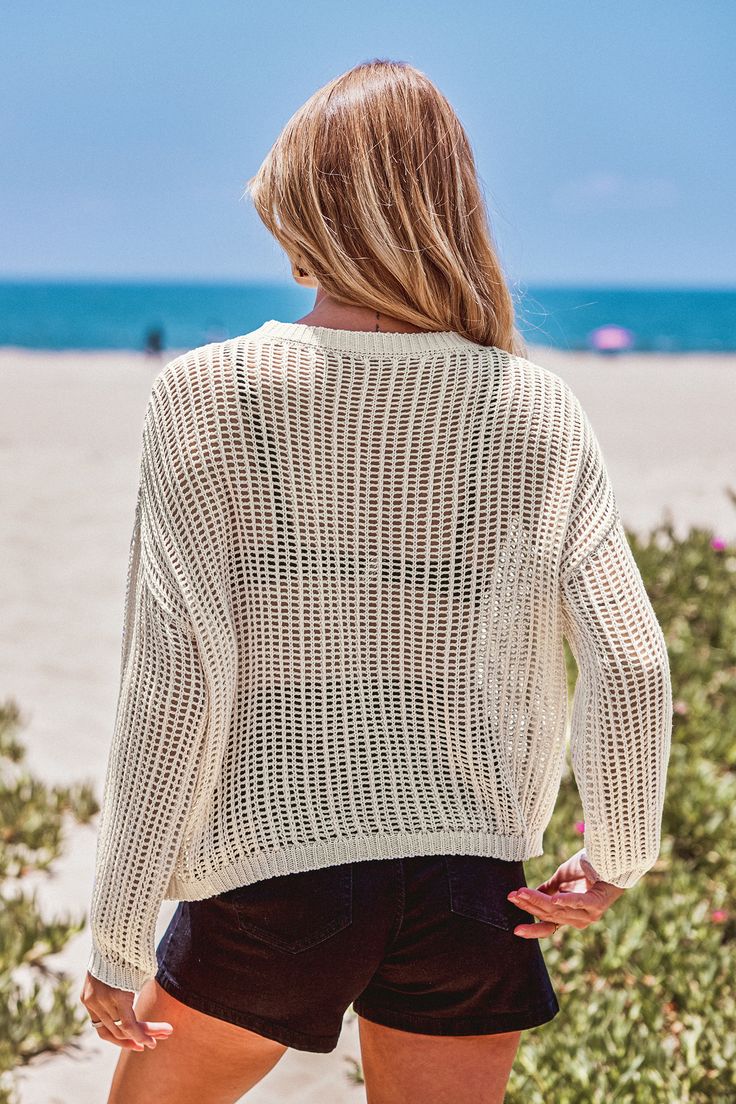 Forget boring beach sweaters. The Open Knit Drop Shoulder Long Sleeve Cover-Up is here to shake things up. With its relaxed drop shoulder design and airy open knit, this cover-up combines cozy vibes with a touch of seaside chic. Product code: CAA07A4G013GG Features:  Knit Round neckline Drop shoulder Long sleeve Wash Method: Regular Wash Material: 100%POLYESTER. Summer Knit Cover-up With Long Sleeves, Vacation Pointelle Knit Long Sleeve Sweater, Long Sleeve Pointelle Knit Sweater For Vacation, Vacation Long Sleeve Pointelle Knit Sweater, Vacation Pointelle Knit Sweater With Crew Neck, Crew Neck Pointelle Knit Sweater For Vacation, Chunky Knit Sweater For The Beach, Lightweight Casual Fall Cover-up, Vacation Crew Neck Sweater In Pointelle Knit