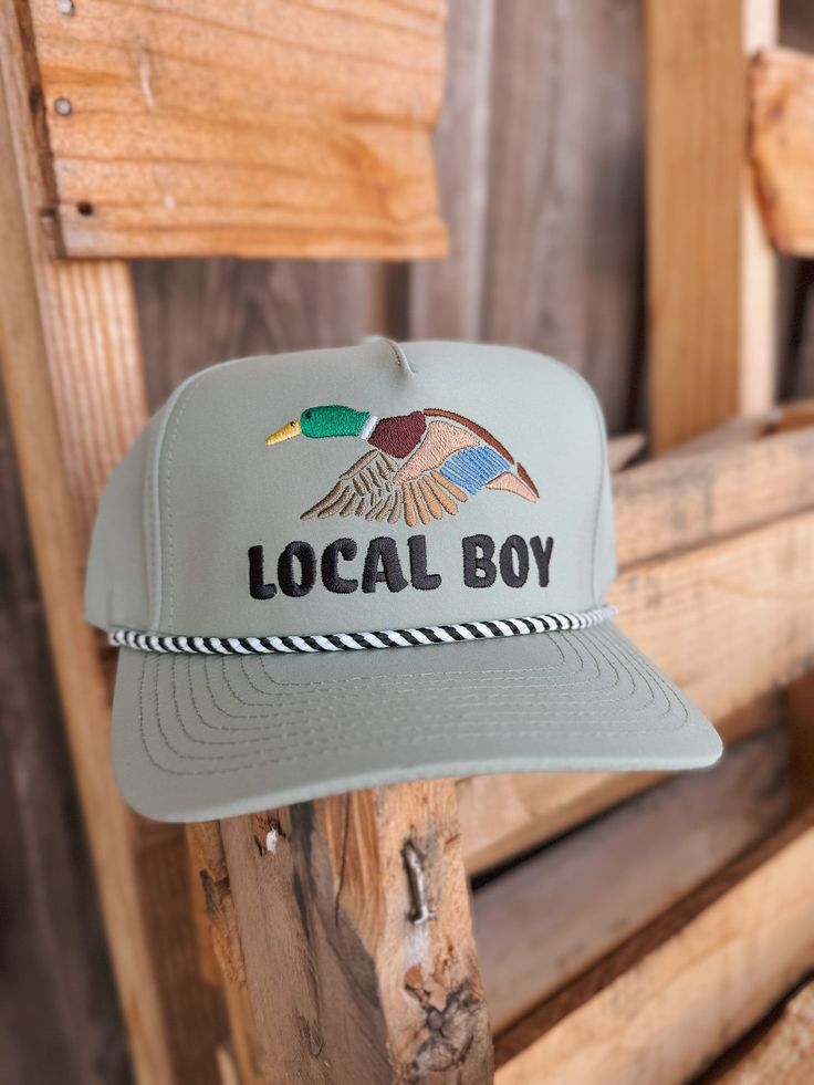 Designed with an adjustable snapback closure, our trucker-style hats are durable, comfortable and breathable. Featuring original designs, Local Boy hats are sure to be an every day staple and fashion statement. Curved Brim Trucker Hat For Baseball Season, Spring Trucker Hat For Outdoor Activities, Baseball Season Trucker Hat With Flat Bill For Outdoor, Baseball Season Trucker Hat With Flat Bill, Adjustable Trucker Snapback Hat For Summer, Flat Bill Trucker Hat For Baseball Season, Snapback Hat For Baseball Season And Outdoor Use, Snapback Hat For Baseball Season Outdoor, Outdoor Snapback Hat For Baseball Season