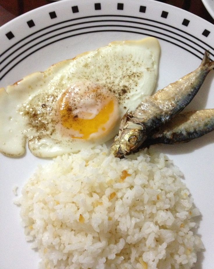 rice, fish and fried egg on a plate