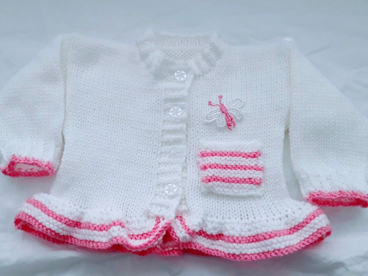 cute knitted baby girls cardigan is the perfect little girls outfit, it matches perfectly with all your other baby clothes, jeans, dresses & leggings and has been a very popular choice  This knitted baby girl Jacket also makes a great gift for new moms, a beautiful coming home baby outfit or to give as a baby shower gift Girls holiday sweater, Girls Christmas sweater or Little girl wedding clothes All my baby knitwear is hand knitted in soft acrylic baby yarn the main colour is silver and you ca Fitted Cotton Knitted Cardigan, Winter Hand Knitted White Top, Hand Knitted White Winter Top, Winter White Hand Knitted Top, Fitted Pink Cute Sweater, Cute Fitted Pink Sweater, Cute Fitted Sweater For Fall, Cute Fitted White Sweater, White Fitted Cute Sweater