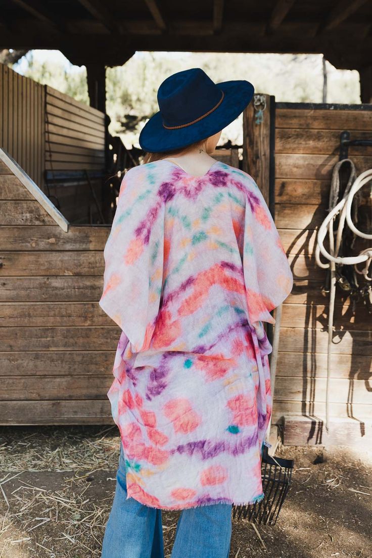 Are you looking for something special to rock at your next music festival? Look no further than the Daydream Tie Dye Cover Up! This kimono is full of stylish fun, sure to make you stand out in a crowd. You'll be the talk of the town with this pretty piece as your go-to festival must-have! #lovemyleto 100% Polyester Imported White Hippie Kimono For Spring, Spring Festival Bohemian Kimono, One Size Festival Cover-up, Multicolor Cotton Kimono For Festival, Spring Festival Free-spirited Kimono, Free-spirited Spring Festival Cover-up, One Size Multicolor Summer Kimono, Summer Multicolor Kimono One Size, Tie Dye Kimono For Festivals