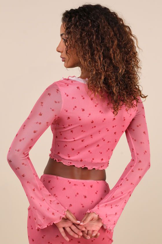 Take your spot as the sweetest babe on the scene in the Daisy Street Cutest Appeal Pink Floral Mesh Bow Ruffled Long Sleeve Crop Top! A slightly blurred rose print adorns stretchy mesh knit as it shapes a square neckline with ruffled trim that creates a cute bow detail at the center, all framed by sheer long sleeves with slightly flared cuffs. Fitted bodice finishes with a handkerchief-style cropped hem. Lettuce edges accent the cuffs and hem. Pair with the matching skirt for a complete look! Fi Fitted Pink Top With Strawberry Print, Long Sleeve Strawberry Print Spring Tops, Long Sleeve Tops With Strawberry Print For Spring, Long Sleeve Top With Rose Print For Spring, Long Sleeve Tops With Rose Print For Spring, Ruffled Crop Top, Crop Top Floral, Handkerchief Style, Mesh Bows