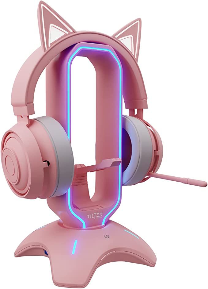 a pink gaming headset with a cat design on the front and an illuminated back