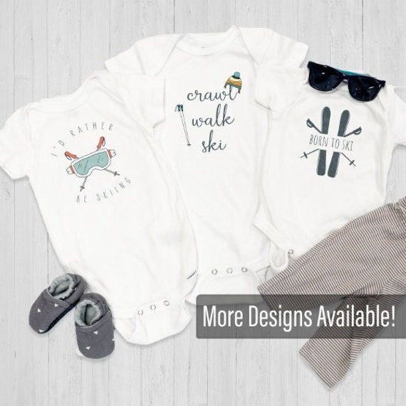 Crawl Walk Ski Onesies® or t-shirts are designed in a lighthearted colorful look. These onesie's® come in newborn, 0-3 M, 3-6M, 6-9M, 12M and 18M. They are 100% cotton rib fabric and machine washable. These classic, cozy onesie's® and tee's are great for everyday wear! -------------------------------------------------- ONESIE® SIZES  Newborn: 5-8 Ibs. - 17-21 in 0-3 Months: 21-24 in. - 6-12 Ibs. 3-6 Months: 24-26 in. - 12-16 Ibs.  6-9 Months: 26-28 in. - 16-20 Ibs. 12 Months: 28-30 in. - 20-24 Ibs. 18 Months: 30-32 in. - 24-28 Ibs. TODDLER T-SHIRT 2T:   28-32 Ibs. - 34 in.  3T:32-35 Ibs. - 34-38 in. 4T:35-39 lbs. - 38-40 in.  5T:39-43 lbs. - 40-44 in. ** Quick Sizing Tip ** Onesies are printed on Gerber organic. These tend to run small so we recommend sizing up if you are on the fence. Tod White Relaxed Fit Casual Onesie, White Casual Relaxed Fit Onesie, Unisex Casual Onesie For Playwear, White Short Sleeve Onesie For Loungewear, Casual Playwear Onesie, Playtime Soft-washed White Tops, Casual Onesie With Graphic Print, Gender-neutral, Unisex Casual Onesie With Graphic Print, White Short Sleeve Casual Onesie