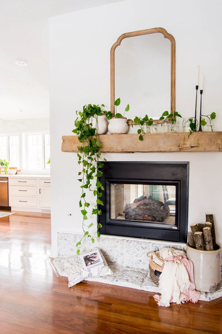 a living room filled with furniture and a fire place in the middle of a room