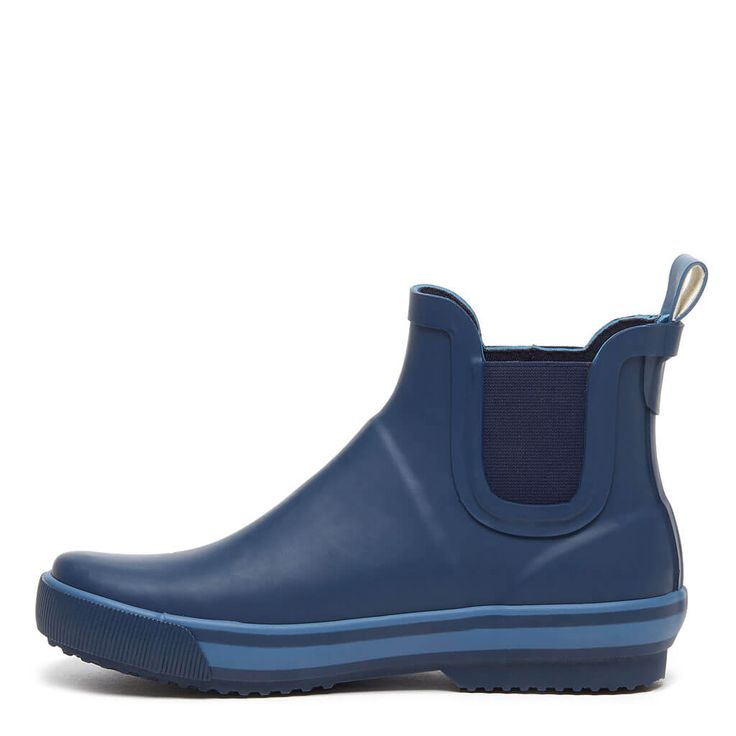 Slide on Rainbow, a navy blue women's bootie with a treaded sole and pop of color along the footbed. Perfect for rainy days calling for a modern look. Style: Rocket Dog women's rain boot Upper Material: Blue rubber with a light blue stripe on footbed Heel Loop: Included for easy on and off Sole: Treaded sole for enhanced traction Footbed: Rubber surrounding footbed Toe Shape: Rounded Shaft Height: Ankle rise Blue Chelsea Boots, Womens Rain Boots, Blue Rain, Chelsea Boots Women, Rocket Dog, Rain Boot, Slide On, Rainy Days, Blue Stripes