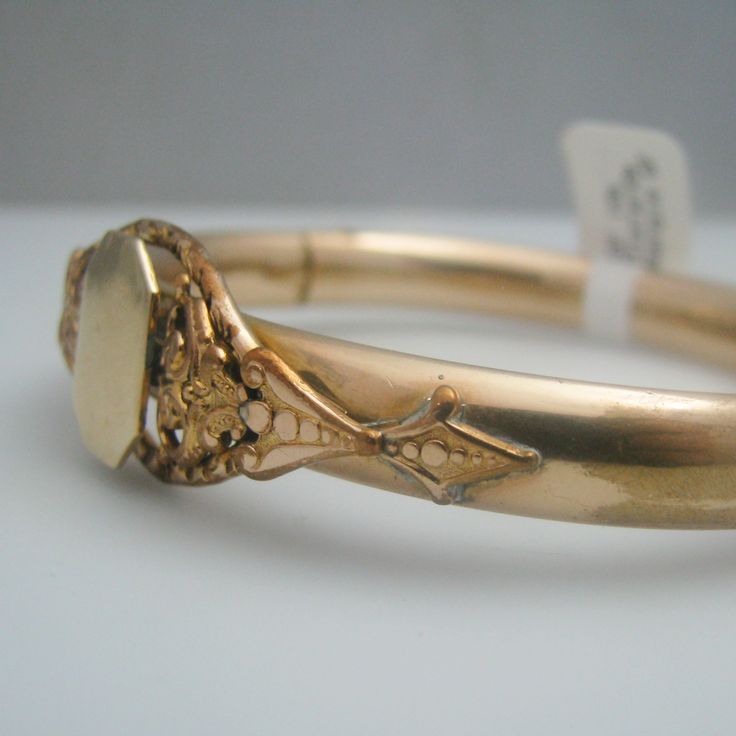 "For sale: (1) d949 Gold Filled 10k Gold Plated 10k Bangle PLEASE READ ENTIRE DESCRIPTION BEFORE PURCHASING Pre-owned item. Good condition. Please see pictures for details. Sold as is, as seen on pictures. The bangle is not stamped, but has been tested for authenticity. Specifics: 10k Gold Filled/Plated Box clasp Length: 8.75 inches Width: 17.5 mm Total Weight: 23 grams Please be 100% sure of your purchase before buying, as we do not offer refunds. We are more than happy to provide any specific Box Clasp, Saint Louis, 10k Gold, Gold Filled, Gold Bracelet, Gold Plate, Bangles, Wedding Rings, Plating