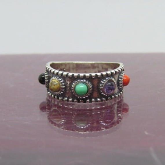 Vintage Sterling Silver Mixed Gemstones Band Ring....Marked 925....Total weight of 3.9g...Measure of Face 7.3MM....it's in very good condition. Spiritual Multi-stone Promise Ring, Spiritual Open Ring With Stones, Spiritual Open Rings With Stones, Adjustable Multi-stone Stackable Rings, Spiritual Round Stone Rings, Adjustable Multi-stone Rings, Sterling Silver Multi-stone Turquoise Ring, Sterling Silver Round Turquoise Multi-stone Ring, Sterling Silver Stackable Rings With Multi-stone