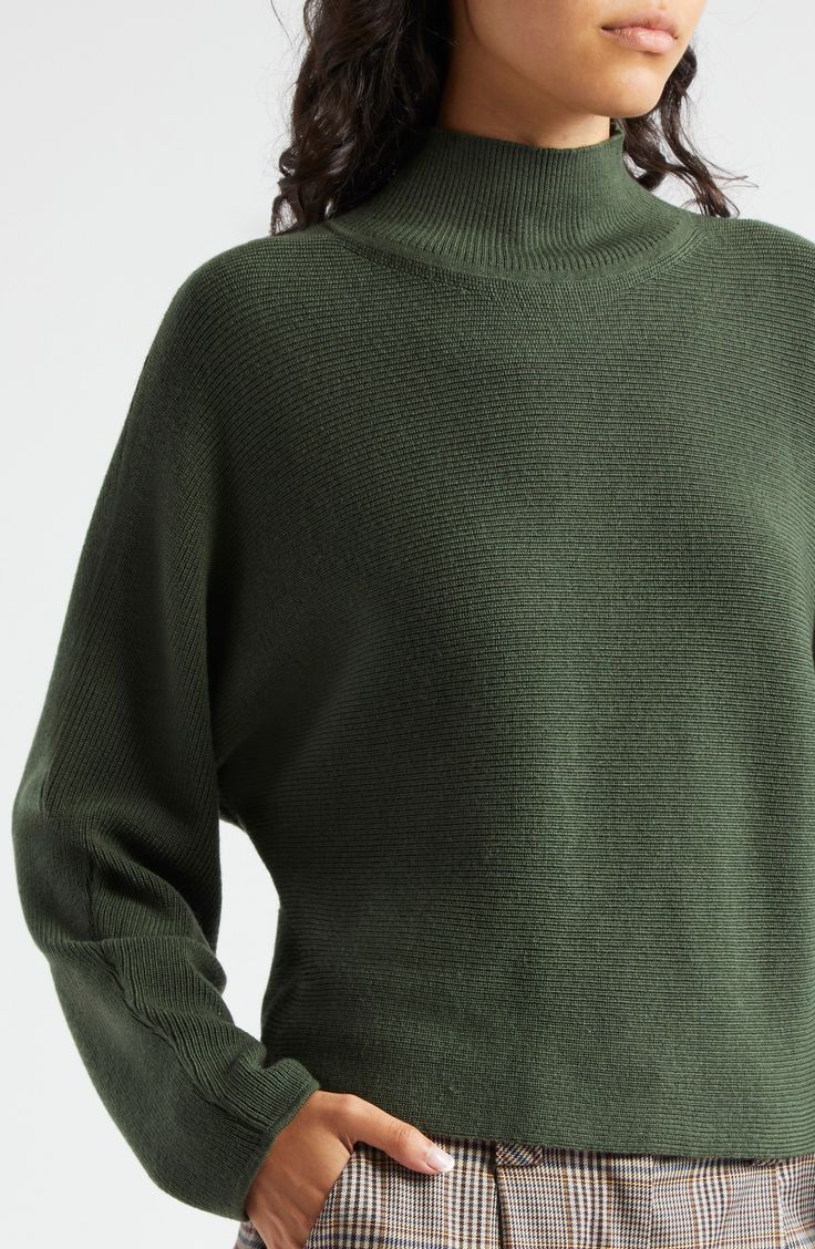 A neat mock neck and an unstructured silhouette define a verdant sweater knit from warming wool. Mock neck Long sleeves 100% wool Hand wash, dry flat Imported Olive Winter Sweater For Layering, High Neck Wool Sweater For Work, High Neck Wool Sweater With Textured Knit, Casual Green Cashmere Sweater, Merino Wool Funnel Neck Sweater For Fall, Textured Knit Funnel Neck Sweater For Work, Green Textured Knit Turtleneck Sweater, Green Sweater For Work, Merino Wool Sweater With Ribbed Funnel Neck