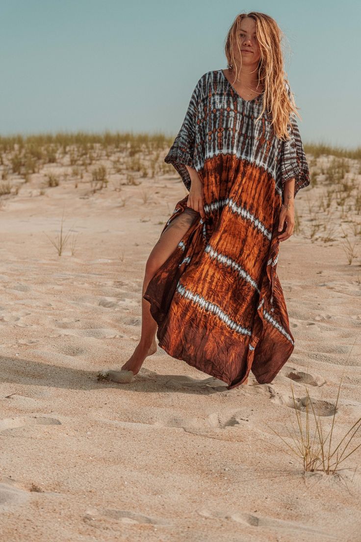 Gorgeous hand tie dyed plant viscose kaftan crafted in a harmonious collaboration of indigo, rust, and caramel dyes. This versatile piece provides a bohemian boxy shape, but comes with a matching fabric belt to cinch in for a tailored fit or use as an elegant hair band. Perfect for a cover-up to get out of the sun, or throw it on for immediate upscale boho style. As part of Gardenbelle Shop's commitment to quality and unique fashion, this kaftan embodies both comfort and chic sophistication. Emb Bohemian Rayon Cover-up For Vacation, Hand Dyed Maxi Dress For Beach, Bohemian Flowy Batik Print Maxi Dress, Bohemian Tie-dye Maxi Dress For Festivals, Hand Dyed Bohemian Maxi Dress, Bohemian Flowy Batik Maxi Dress, Beach Tie Dye Maxi Dress With Natural Dye, Bohemian Flowy Hand Dyed Maxi Dress, Bohemian Flowy Hand-dyed Maxi Dress