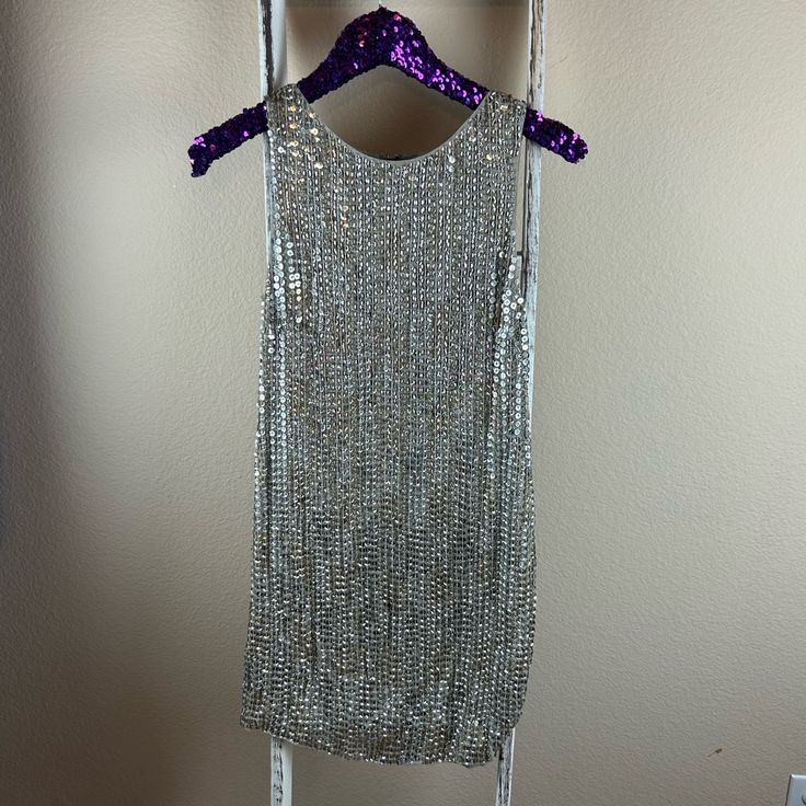 Preowned Alice + Olivia Women's Silk Sleeveless Silver And Gold Sequin Dress Size 2. Armpit To Armpit 14.5in And From Shoulder To Bottom Hem 32.5in. Zipper Is In Excellent Working Condition, No Missing Beads. Shell 100% Silk Lining 95% Polyester 5% Spandex. Smoke/Pet/Stain/Hole Free. Made In India. I Wore This Dress For My Courthouse Wedding. Save $10 Off Your First Purchase When You Sign Up For Poshmark Using My Code Fromtxswithlove Metallic Sleeveless Mini Dress With Sequins, Holiday Sleeveless Mini Dress With Shimmer, Metallic Sleeveless Dress For Party Season, Metallic Embellished Sleeveless Mini Dress, Metallic Sequin Sleeveless Evening Dress, Sleeveless Embellished Metallic Mini Dress, Embellished Sleeveless Metallic Mini Dress, Fitted Sleeveless Silver Sequin Dress, Metallic Sleeveless Sequin Dress