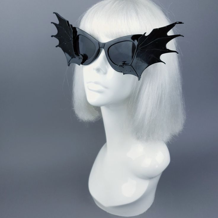 Hand-decorated black sunglasses with large molded bat wings. You can get these sunglasses in different coloured bat wings! Currently my list is: Black White Red Silver (£5 extra) Gold (£5 extra) Yellow Orange Green Pink Pastel Pink Blue Pastel Blue HOWEVER most of my sunglasses base is red, white or black at this time. Just message me at the checkout to ask if i can change the colour! The filigree sunglasses are made of lots of little pieces of filigree i have moulded, so though the same filigre Black Plastic Costume Accessories For Cosplay, Plastic Sunglasses For Halloween Party, Gothic Black Cat Ears Costume Accessories, Black Punk Sunglasses With Tinted Lenses, Punk Black Sunglasses With Tinted Lenses, Edgy Halloween Costume Accessories For Party, Halloween Party Sunglasses In Plastic, Halloween Party Plastic Sunglasses, Gothic Black Sunglasses For Party