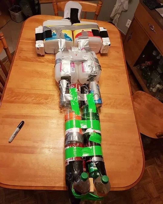 a wooden table topped with lots of cans