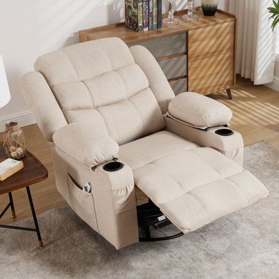 a beige recliner chair sitting on top of a rug