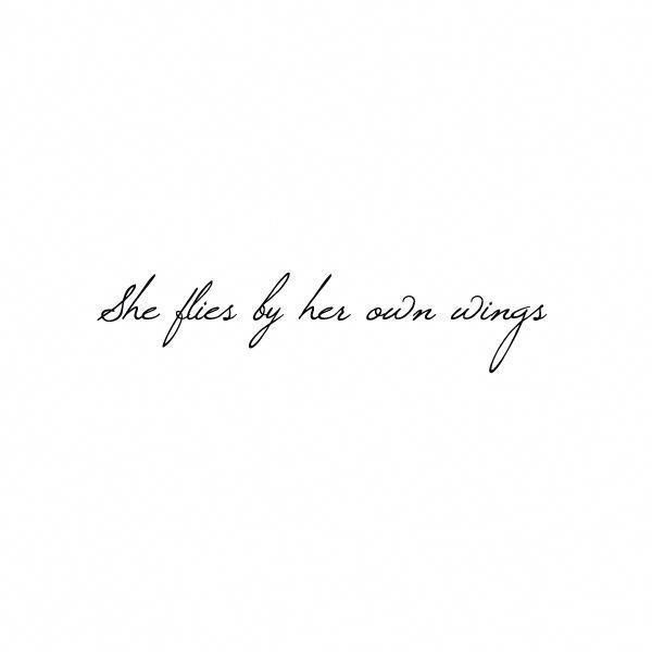 the words she flies by her own wings are written in cursive handwriting on white paper