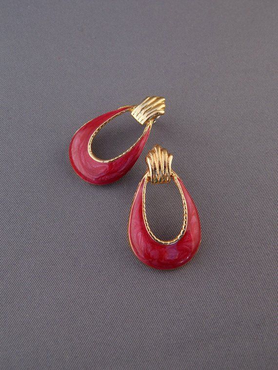 Red Enamel Earrings, Door Knockers Earrings, Raspberry Red Earrings, Red and Gold, 1980's Kitsch Earring Doorknockers♥ Lovely vintage earrings with raspberry red enamel over a gold tone metal. These are faux door-knockers, meaning they look like door-knockers, but do not dangle. Very elegant earrings, beautiful color, a great addition to your jewelry collection. ♥ Pierced earrings with posts in the back♥ Measure approx. 1-1/4" long x 3/4" wide ♥ Excellent condition. Please review the pictures.♥ Vintage Red Teardrop Jewelry, Red Enamel Clip-on Jewelry, Red Enamel Clip-on Earrings, Vintage Enamel Earrings For Evening, Vintage Style Enamel Earrings For Evening, Vintage Style Enamel Earrings For Evening Wear, Retro Red Clip-on Earrings For Formal Occasions, Retro Enamel Jewelry For Party, Retro Enamel Party Jewelry