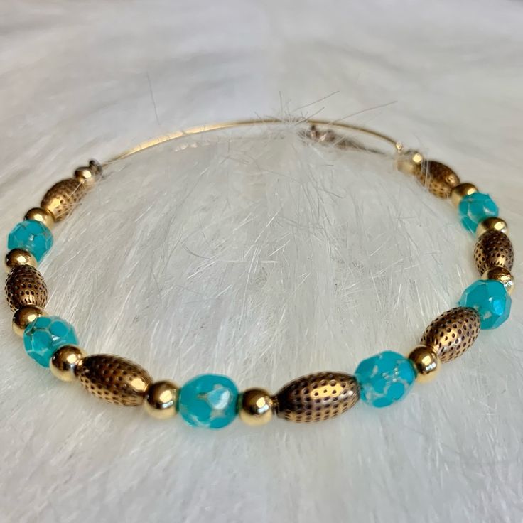 Alex & Ani Vintage Beaded Bracelet Beautiful Deep Aqua Blue-Green Glass Beads Alternating Shiny Gold & Oval Dimpled Gold Beads Adjustable Gold Wire Bracelet Brand New Without Tag Turquoise Amazonite Beaded Bracelet With 8mm Beads, Turquoise Hand-strung Beaded Bangle Bracelet, Alex And Ani Beaded Bracelets, Adjustable Multi-strand Turquoise Beaded Bracelets, Vintage Beaded Bracelet, Bohemian Turquoise Multi-strand Beads, Alex And Ani, Wire Bracelet, Gold Wire